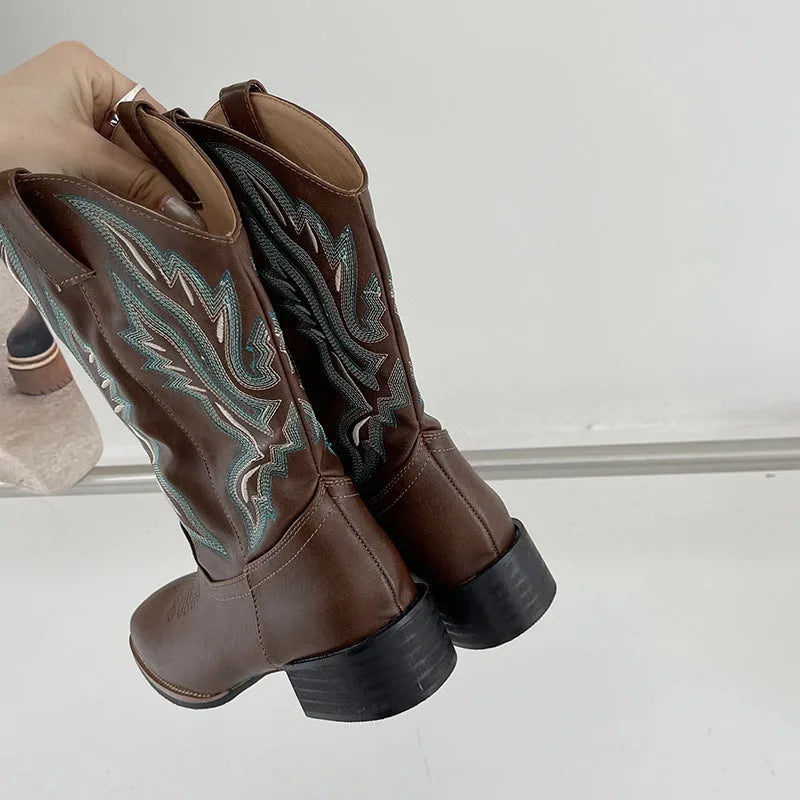 Brown women's mid-calf Martin boots with embroidered detail on the shaft.