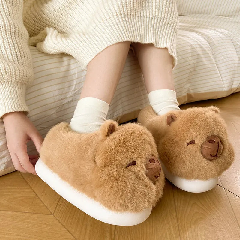 Light brown women's winter slippers with cartoon pattern, plush upper, and thick PVC sole