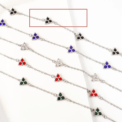 Women's stainless steel bracelet with three triangle-shaped charms in different coloured stone settings