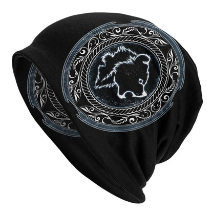 A black cotton hat with a white Viking wolf graphic and an elasticated sleeve cap construction.