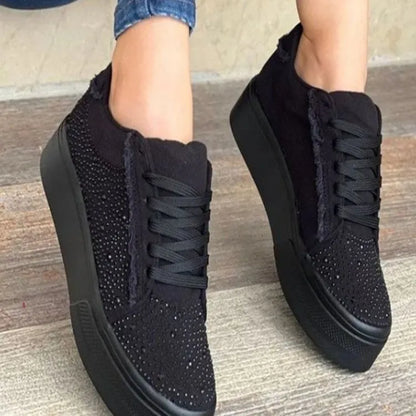 Plus size women's black lace-up casual shoes with rhinestone detail on round toe and thick rubber sole.
