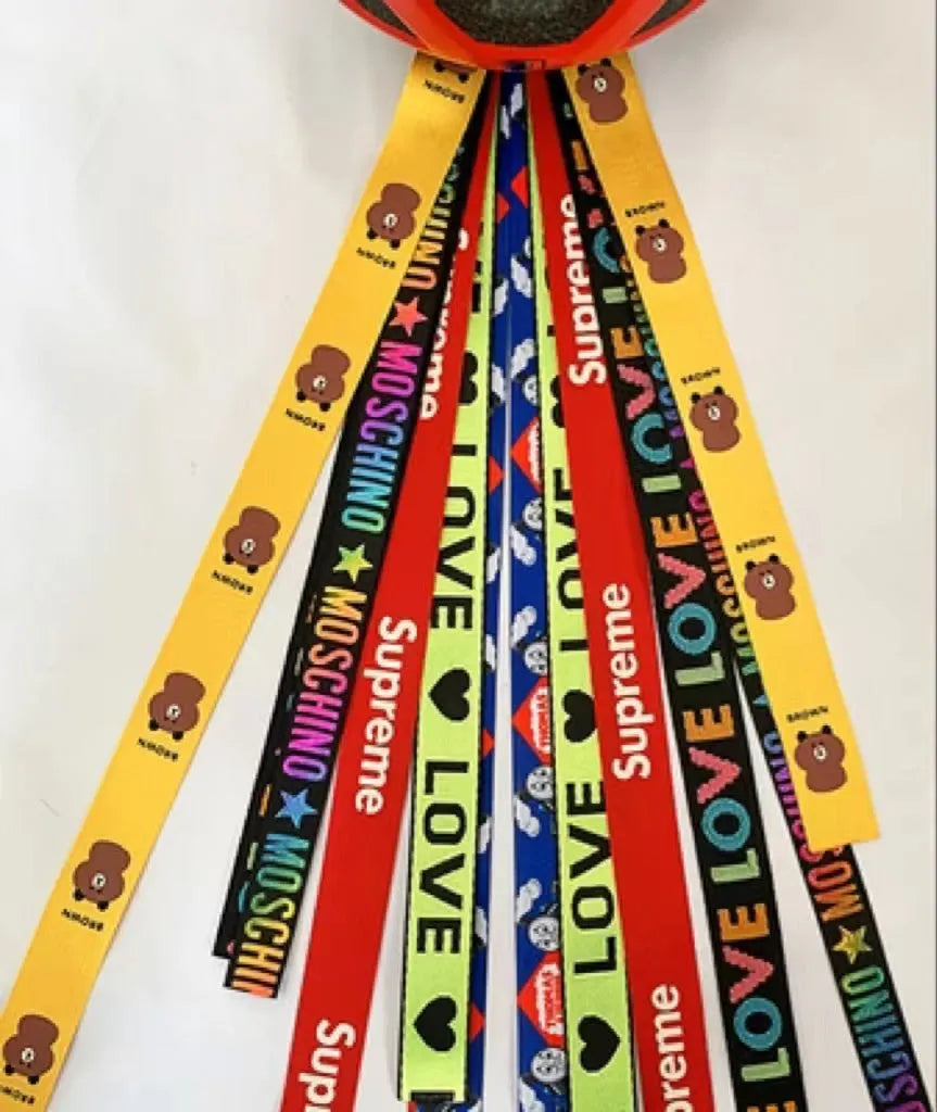 Children's helmet streamer with 60 cm polyester ribbon in colours like apricot and khaki for roller skating and skiing