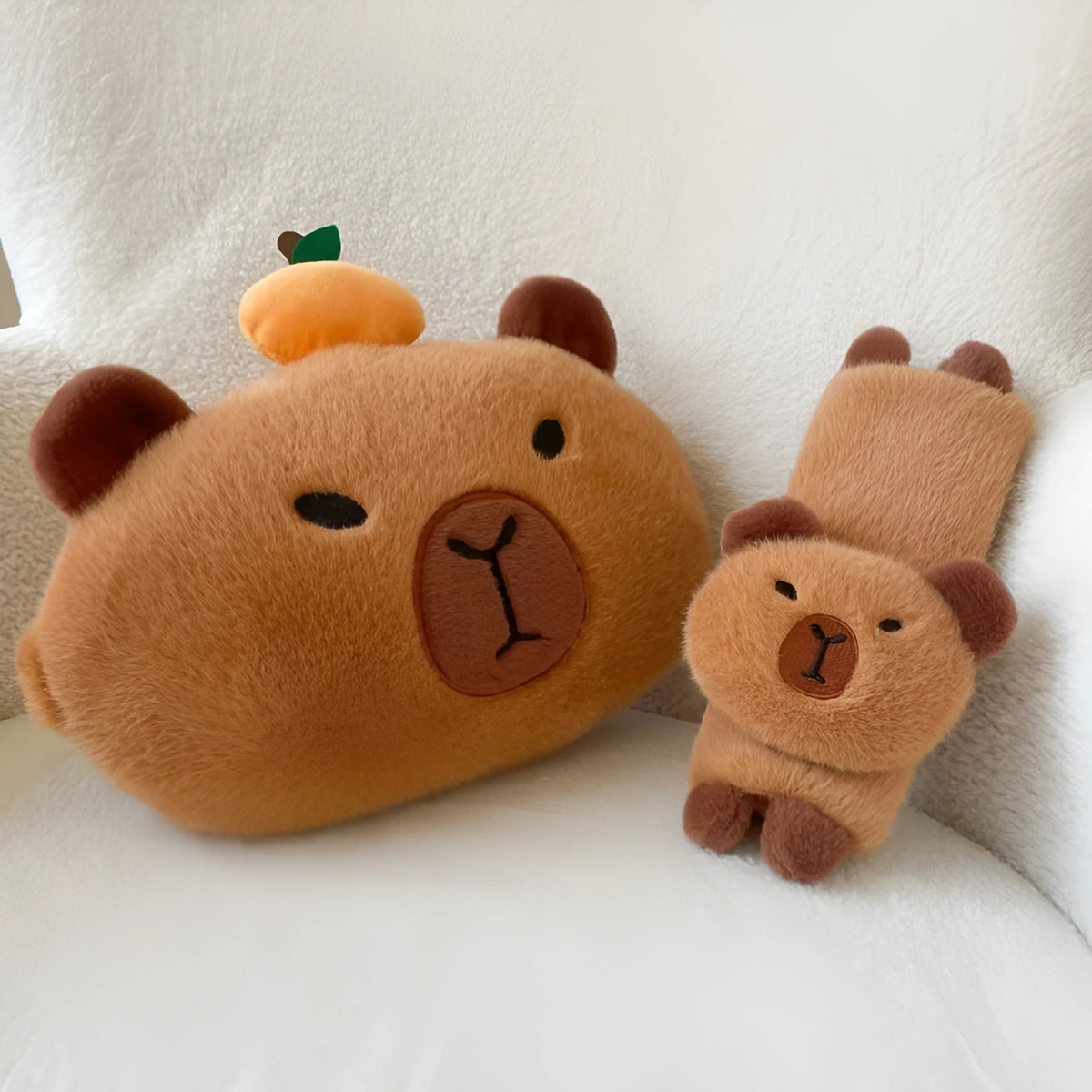Khaki capybara car pillow in artificial plush with synthetic fibre filling, shown as a car neck pillow or shoulder cover.