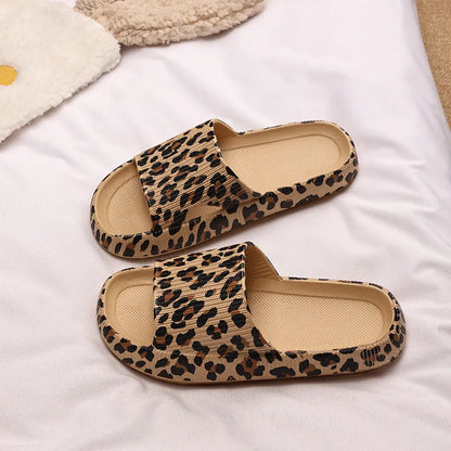 Women's leopard print slippers with a thick EVA sole in multiple colour options on a white background.