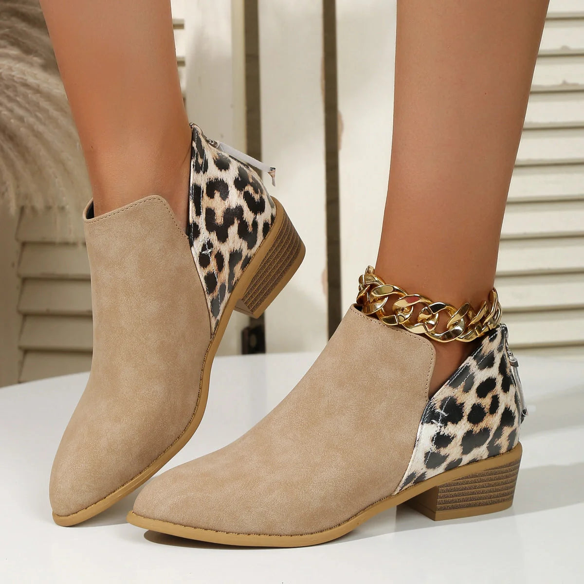 Women's leopard print boots with pointed toe and chunky heel in various colors