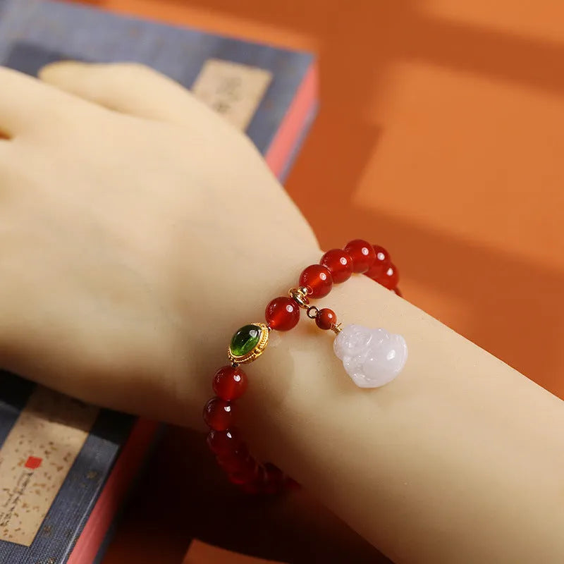 Handcrafted red agate bracelet with amber beads, jade accents, and Maitreya Buddha pendant in Chinese geometric style