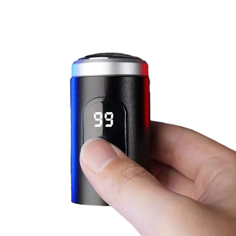 Black mini portable rechargeable shaver with USB cable and cleaning brush on a white background