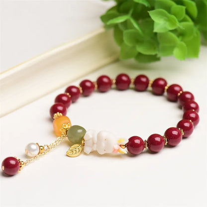 Natural cinnabar rabbit bracelet in beeswax purple and gold sand, national style, shown in 8mm and 10mm sizes.