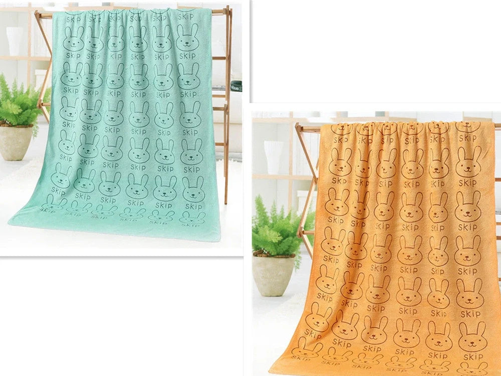 Microfiber bath towel with cartoon character print measuring 70cm wide by 140cm long