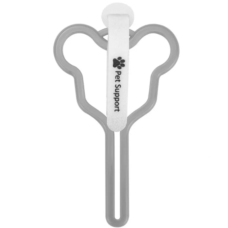 A dog poop bag dispenser with a hands-free clip and adjustable Velcro strap attached to a dog lead.