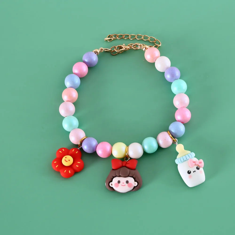 Adjustable resin pet collar with macaron designs in six colours, showing sizing from 15-38cm