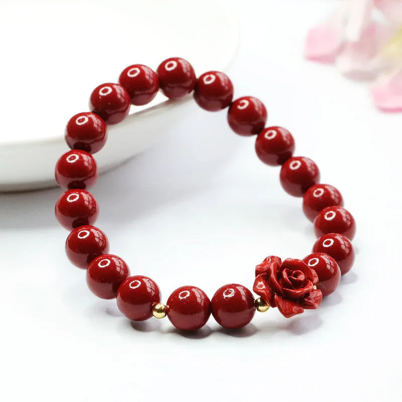 Close-up of a handmade purple gold sand cinnabar rose bracelet with an 8mm bead.