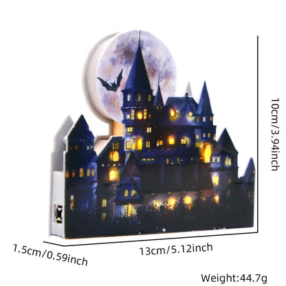 LED illuminated castle ornament with turrets and textured surfaces on desktop