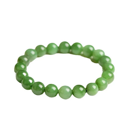 Natural jasper ball bracelet with polished Hetian jade beads in multiple sizes from 4mm to 12mm on wrist
