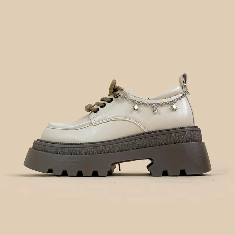 White women's platform Mary Jane shoes with a round toe and thick chunky heel.
