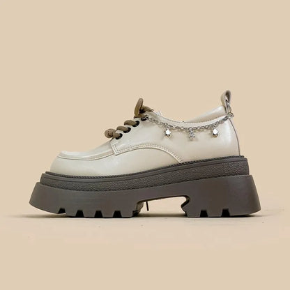 White women's platform Mary Jane shoes with a round toe and thick chunky heel.