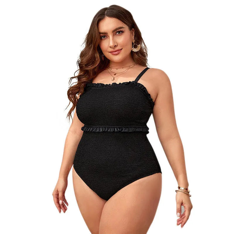 Black solid colour one-piece swimsuit for women on a mannequin, showing sleeveless briefs style.