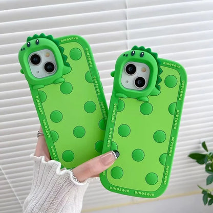 Green polka dot dinosaur silicone phone case showing back design and side protection for iPhone
