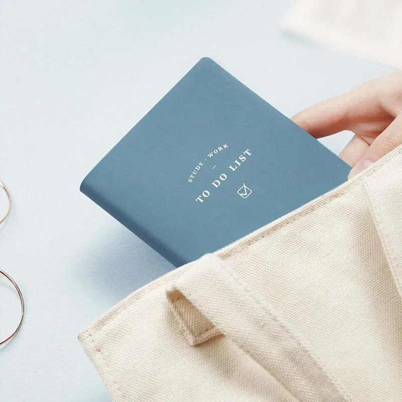 Simple style portable todolist notebook in blue, green, pink, or yellow with PU cover and 96 pages.