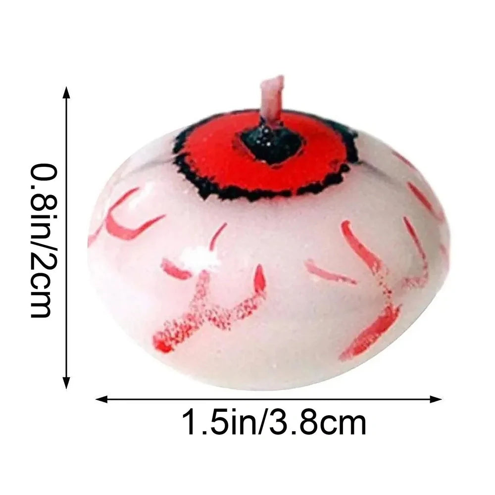 Red oval paraffin floating candle resembling eyeball in Halloween water display
