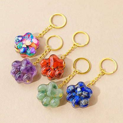 Natural crystal cat's paw keychain pendant showing gemstone options with integrated attachment loop