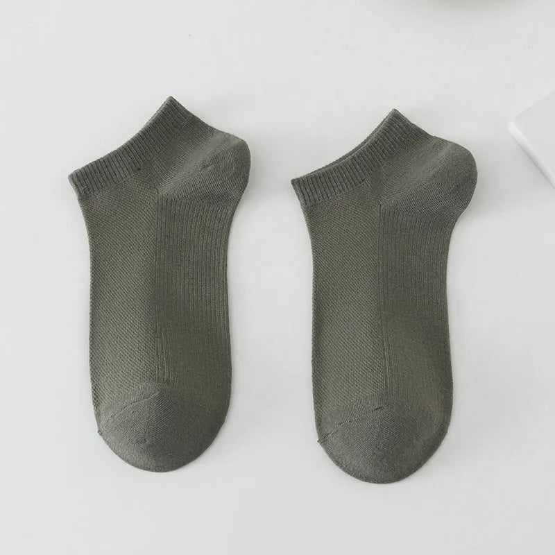 Pair of solid colour low-cut polyester boat socks for men, shown in one of six available colour options.