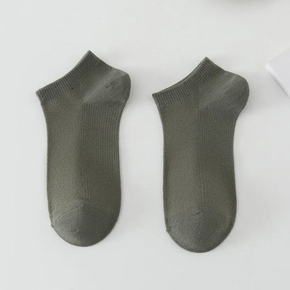 Pair of solid colour low-cut polyester boat socks for men, shown in one of six available colour options.
