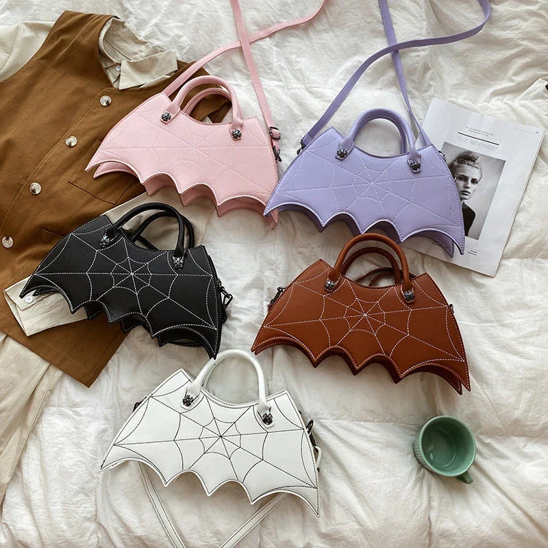 Stylish Halloween spider web crossbody bag in various colors, including black, white, brown, pink, and purple