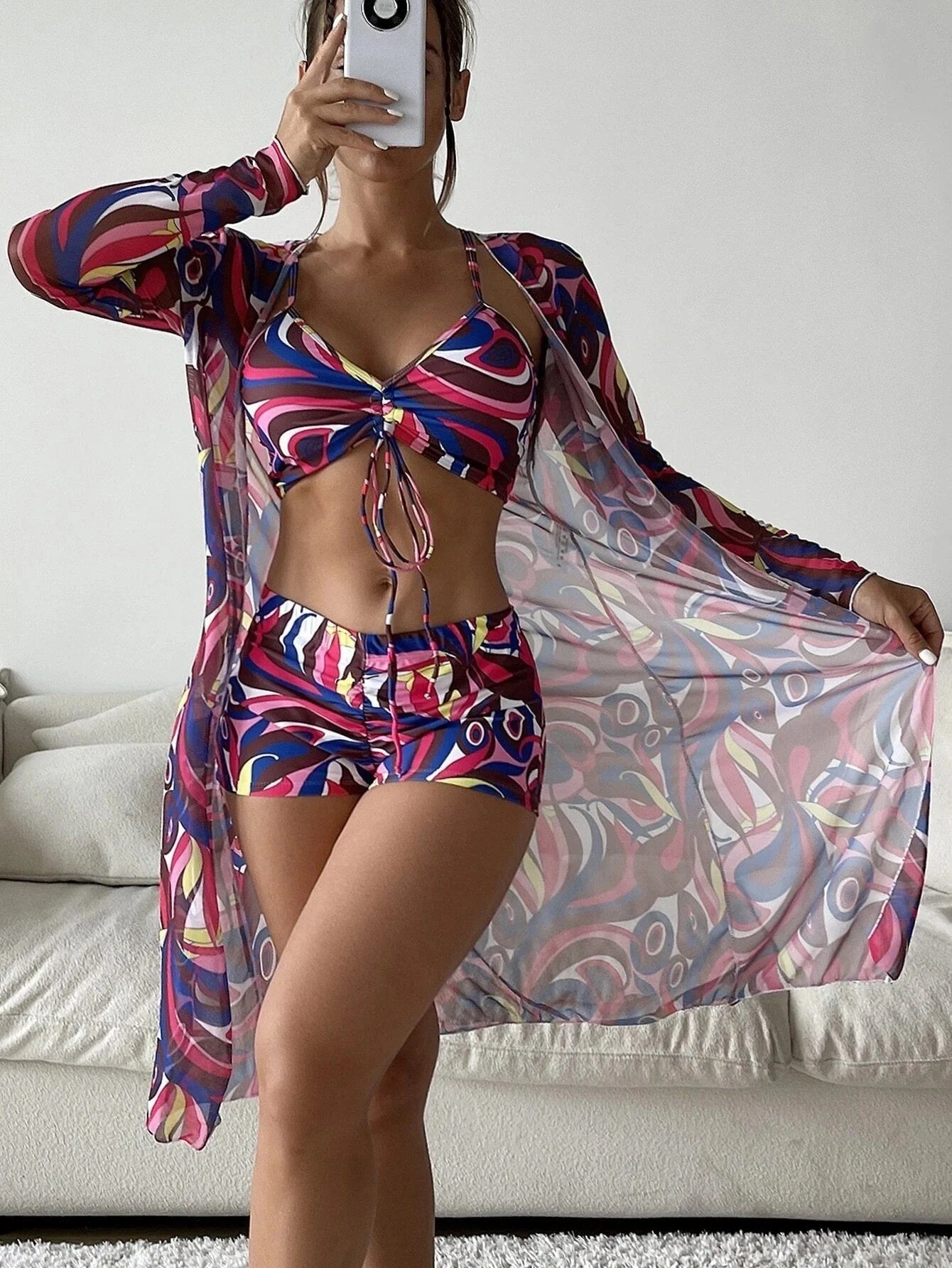 Women's floral print bikini set with long sleeve cardigan for summer beach outings