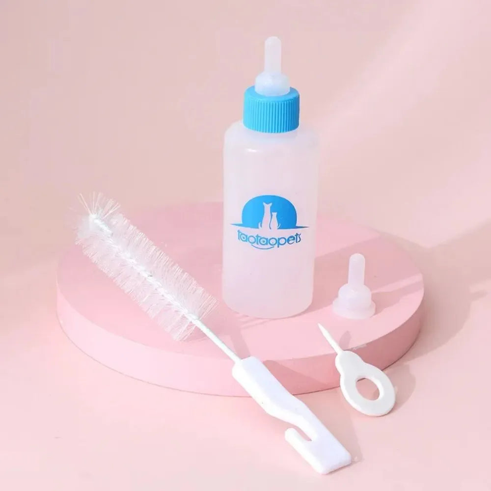 Four pet milk bottles in blue, green, pink and yellow colours with cleaning brush for small animal feeding