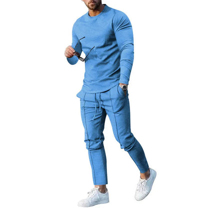 Men's light grey polyester two-piece suit set with long sleeve round neck T-shirt and matching trousers.