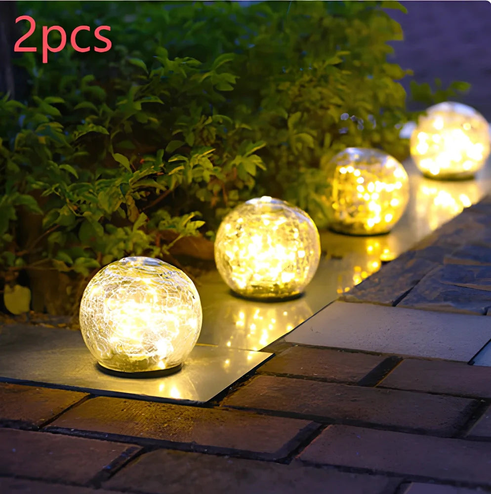 Cracked glass ball LED solar light, 10cm size with warm white glow for garden paths, waterproof and ground stake included