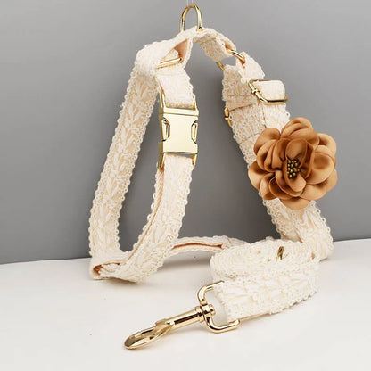 White lace dog vest and matching collar with floral decoration for wedding or special occasion.