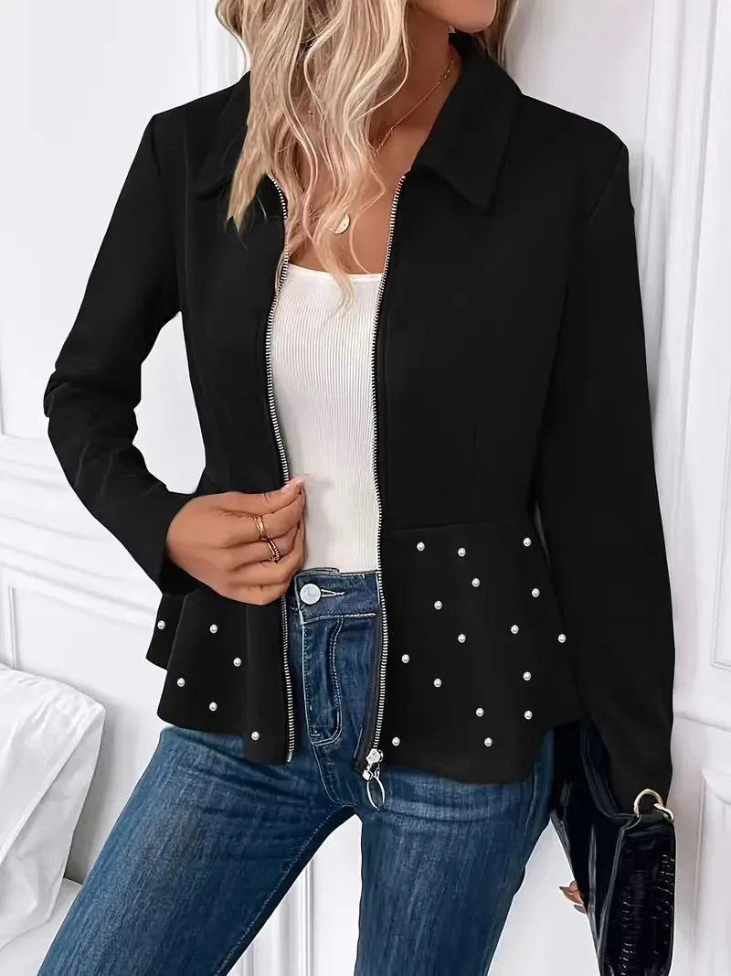 Women's black coat with heavy-duty zipper and ruffled hem detail in loose-fitting silhouette