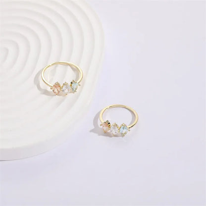 Geometric women's copper ring with triangle design, tricolour zircon stones, and birthstone in electroplated gold finish