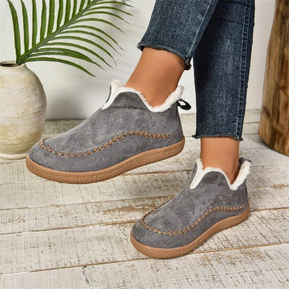 Stylish plush ankle boots for women featuring a unique V-cut design, soft interior, and durable materials for warmth and comfort in cold weather.