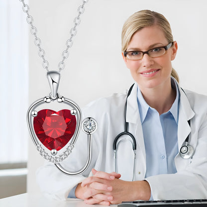 Red diamond wings cross stethoscope pendant necklace on a copper chain.