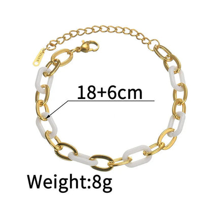 Stainless steel bracelet with double-layer heart design containing resin elements, shown on wrist