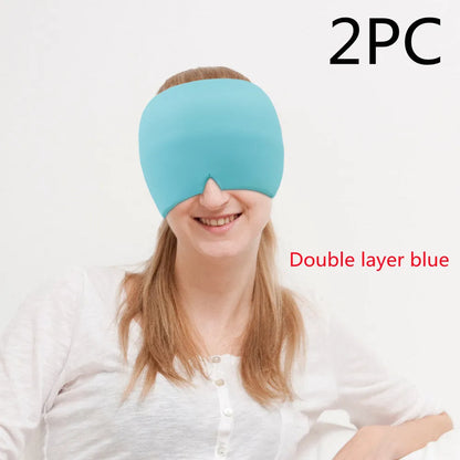 Black elastic cooling gel eye mask for headache relief placed on a forehead.