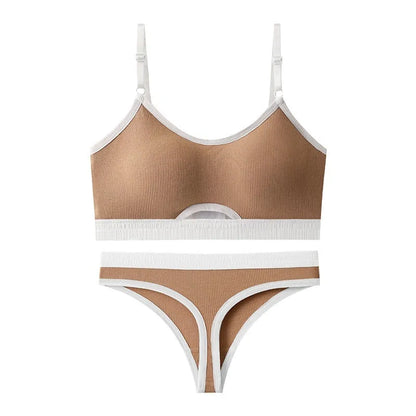 Women's white cotton sports bra with double straps and seamless back, paired with matching underwear