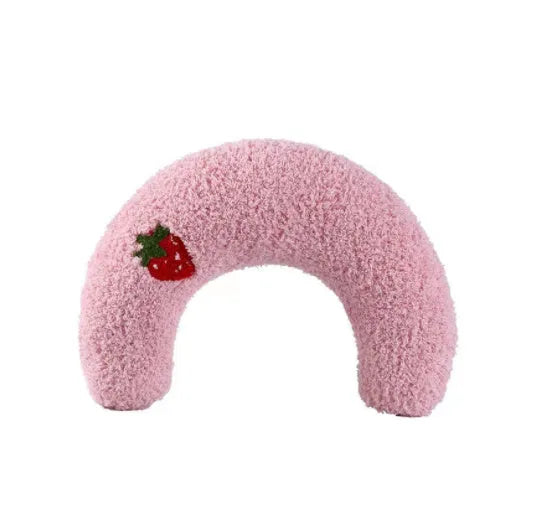 White U-shaped pet pillow measuring 27cm with raised rim supporting small cat's neck and back