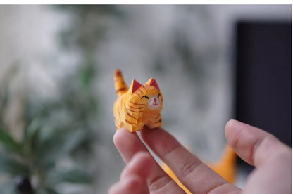 Handmade wooden cat trinkets in gray and orange, perfect for decor or gifts