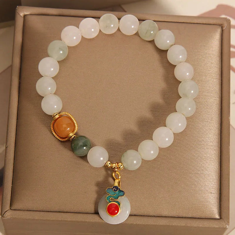 Ice jade crystal bracelet for women with Xiangyun peace jade buckle and pearl accents.
