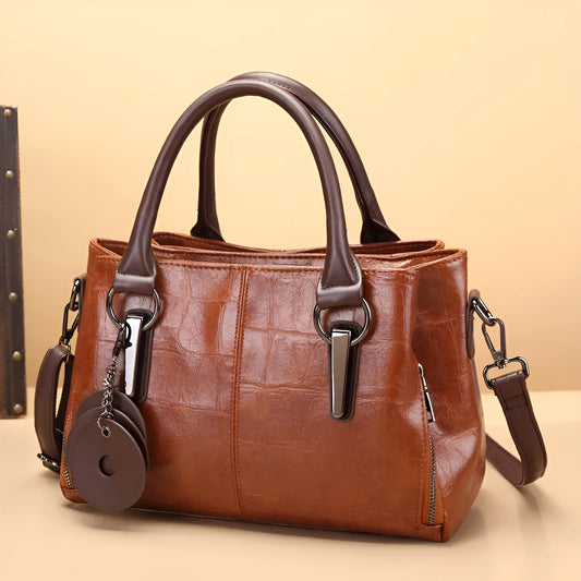 Retro contrast large capacity shoulder bag showing horizontal square shape and multiple internal compartments