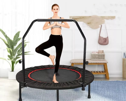 Red and black indoor trampoline with optional safety handrail for kids and adults