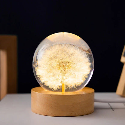 Enchanting 3D dandelion, yellow daisy, or red daisy flowers suspended in a clear crystal ball with a beech wood base, creating a mesmerizing desktop decor piece.