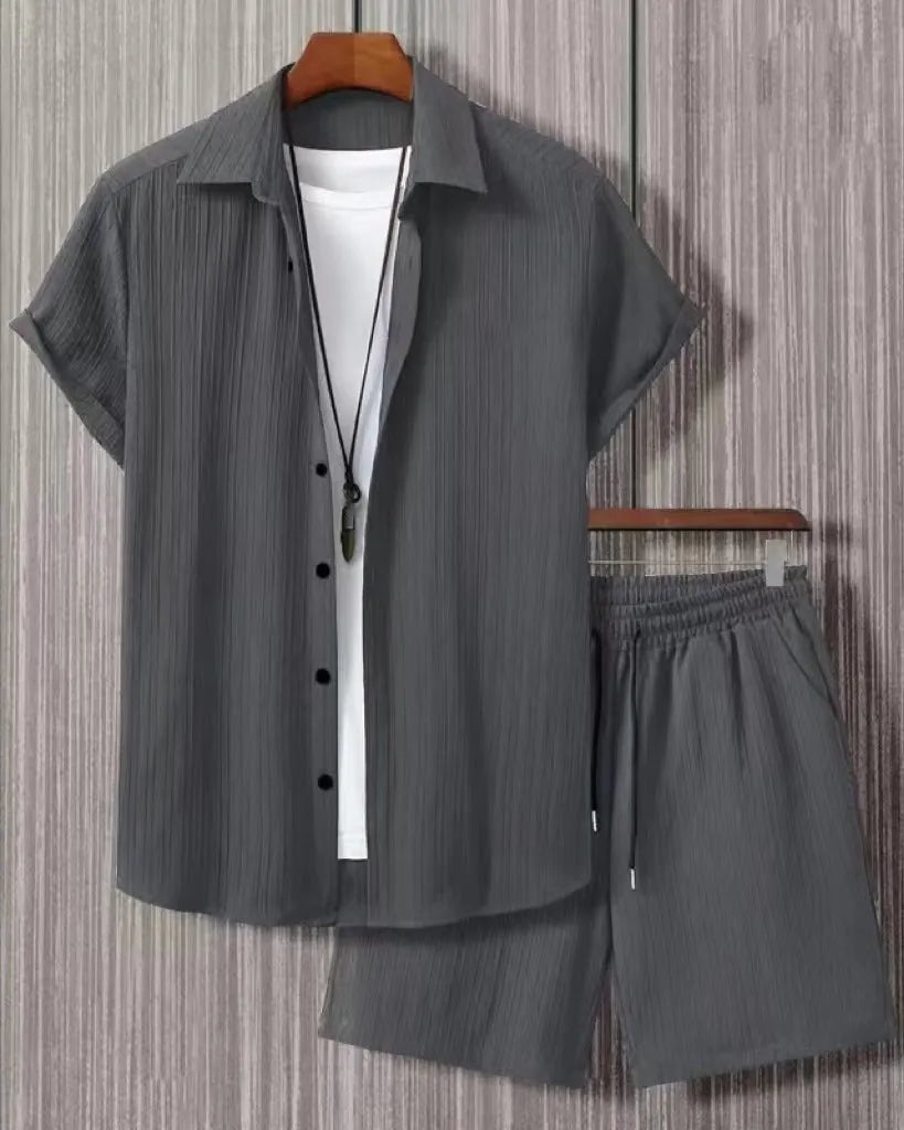 Jacquard short sleeve suit separates in chemical fibre blend polyester with shirt-style jacket and matching shorts