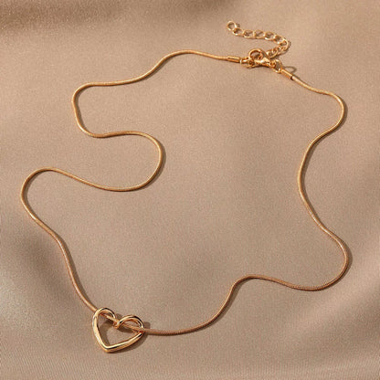 Niche Hollow Heart Necklace for women with snake bones chain and electroplated alloy