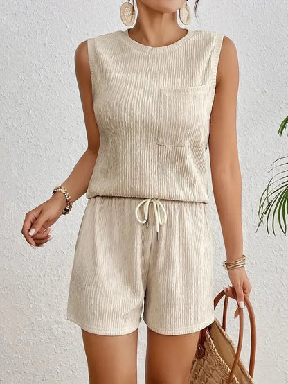 Solid colour sleeveless round neck vest and shorts set in apricot or orange, 100% polyester fabric