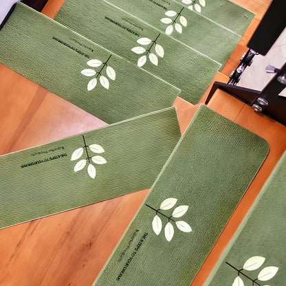 Self-adhesive luminous stair mat with glow strips on wooden staircase, rectangular design with hemmed edges